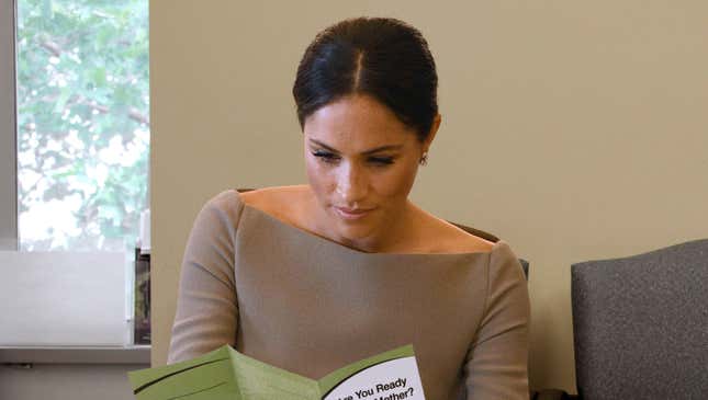 Image for article titled Meghan Markle Nervously Looking Over Clinic Pamphlets Weighing Her Options