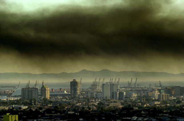 Toxic smoke blows over downtown Long Beach, CA, April 23, 2001 from a fire at the Tosco oil refinery in Carson, 15 miles south of Los Angeles.