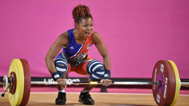 woman with a barbell at a weightlifting competition