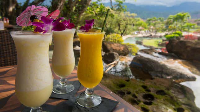 Frozen drinks over scenic Hawaiian landscape