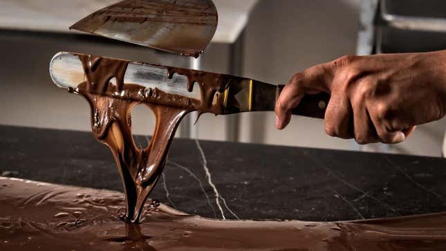 A chef tempering chocolate. (You don’t need any special tools to do it at home.)