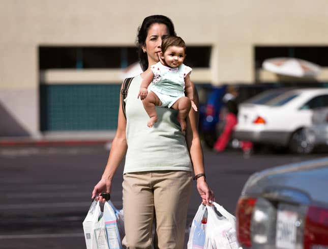 Image for article titled Mom With Arms Full Of Groceries Holds Baby By Scruff Of Neck With Mouth