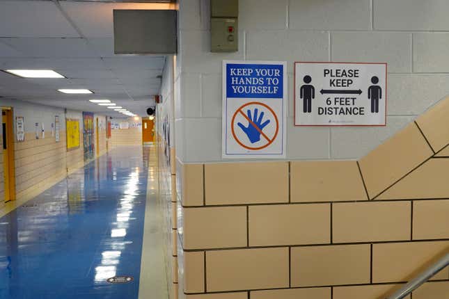 Signs in a hallway at King Elementary School encourage social distancing as the school works to maintain a safe environment during the coronavirus pandemic on September 08, 2020 in Chicago, Illinois. 