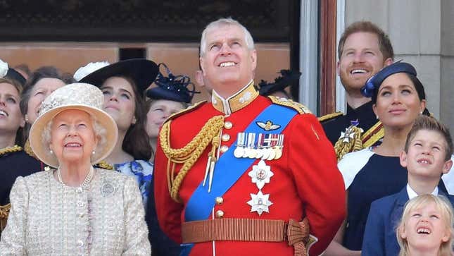 (L-R) Britain’s Queen Elizabeth II, Britain’s Princess Eugenie of York, Britain’s Prince Andrew, Duke of York, Britain’s Prince Harry, Duke of Sussex, and Britain’s Meghan, Duchess of Sussex, stand with other members of the Royal Family on the balcony of Buckingham Palace  on June 8, 2019. 