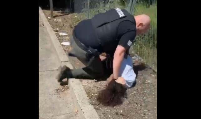 Image for article titled Video Appears to Show Police Officer Repeatedly Punching and Slamming a 14-Year-Old Black Child