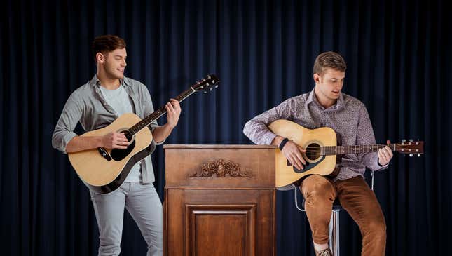Image for article titled Nation’s Men Holding Acoustic Guitars Announce Plan To Idly Strum While You Try To Talk To Them