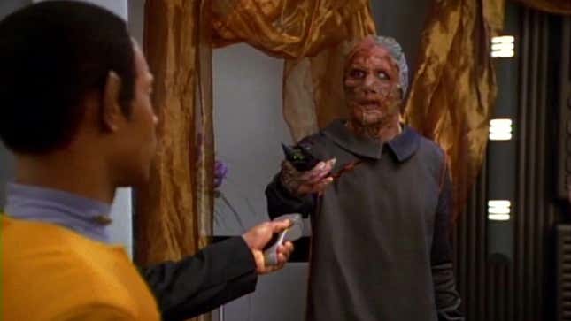 Tuvok reaches for his phaser thinking the Vidiians are up to no good.
