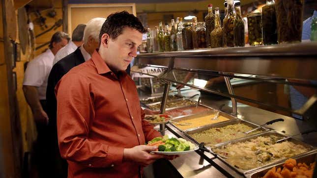 Schultz scolds himself for filling nearly his entire plate before even exiting the vegetable section.
