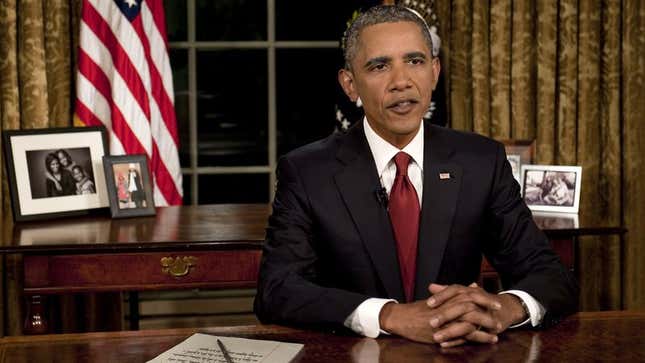 Image for article titled Obama Practices Defiant Speech To Aliens Late At Night Behind Oval Office Desk