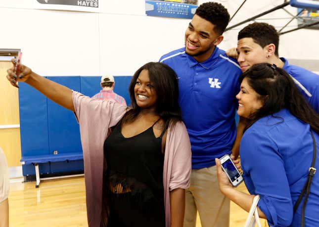 Back when he was with the Kentucky Wildcats, Karl-Anthony Towns (middle) and teammate and current Phoenix Sun Devin Booker take a selfie with Karl-Anthony’s girlfriend, left, India Gentry and Towns’ mother Jacqueline Cruz-Towns back in 2015. Cruz-Towns passed away in April due to COVID