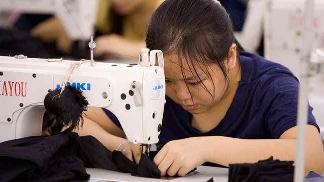 Image for article titled Exhausted Sweatshop Worker Just Has To Laugh After Sewing Fingers Together