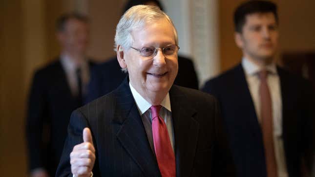U.S. Senate Majority Leader Mitch McConnell (R-KY) gives a thumbs up sign after speaking on the floor of the U.S. Senate on March 25, 2020 in Washington, DC. (Photo by Win McNamee/Getty Images)