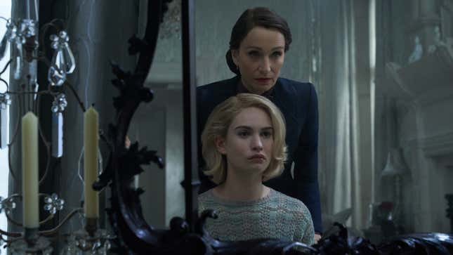 Kristin Scott Thomas (standing) and Lily James in Rebecca