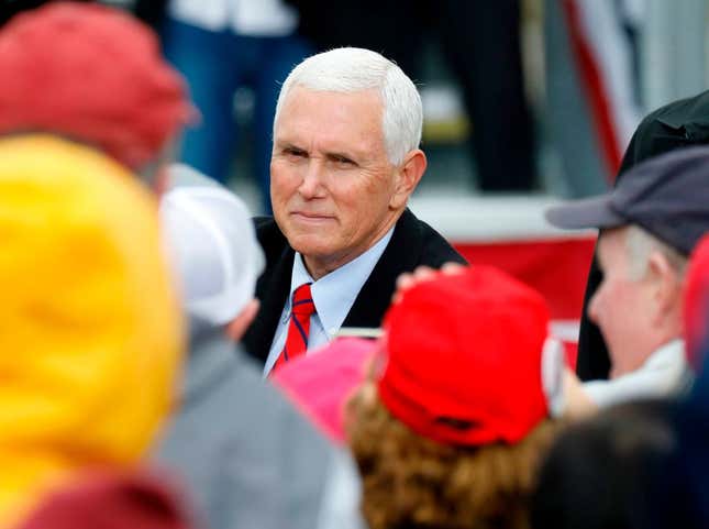 US Vice President Mike Pence greets supporters after his “Make America Great Again!” campaign event at Oakland County International Airport in Waterford, Michigan, on October 22, 2020.
