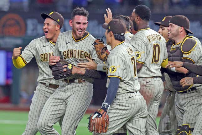 Padres’ pitcher Joe Musgrove is mobbed by teammates after authoring first no-hitter in S.D. history.