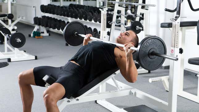 guy preparing to do incline bench. I bet he can do more though