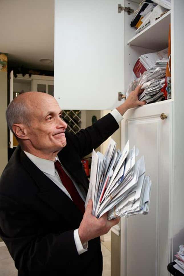 Chertoff looks in vain through the cabinet where the Department of Homeland Security keeps all its bills.