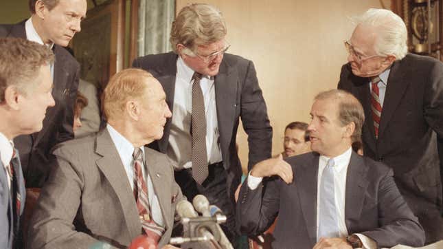 From left to right: Sen. Strom Thurmond at the microphone, Sen. Ted Kennedy standing in the center, Sen. Joe Biden seated on the right, and Sen. Howard Metzenbaum standing on the far right.