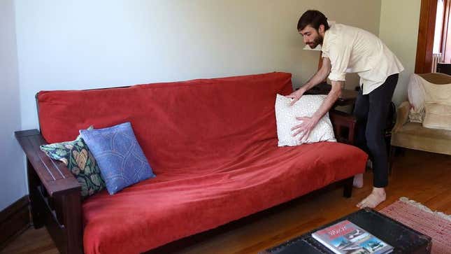 Image for article titled Man Getting Futon All Dolled Up For Craigslist Photo Shoot