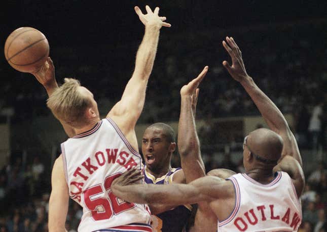Kobe takes on three Clippers in 1997. Photo credit: Chris Pizzello/AP