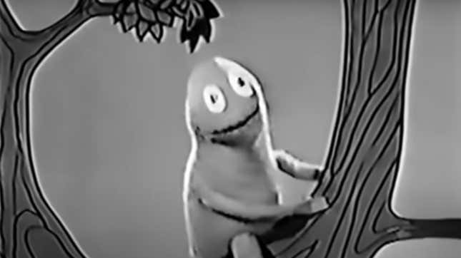 Jim Henson's Kermit-like Wilkins character sits in a tree