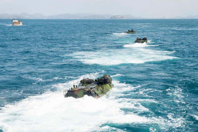 Assault amphibious vehicles (AAV) assigned to 31st Marine Expeditionary Unit depart the well deck of USS Green Bay (LPD 20) in preparation for an amphibious exercise.