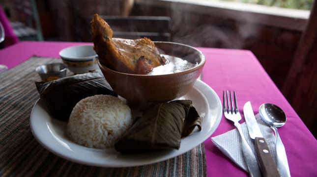 Kaq-ik is served with rice, tamales, and a turkey leg that you dip into the stew.