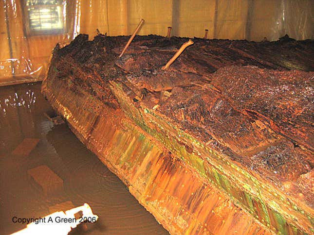 Inside face of ship’s timbers. The hull undergoing spray treatment by Charles Fithian and his staff at the State of Delaware Historical and Cultural Affairs.