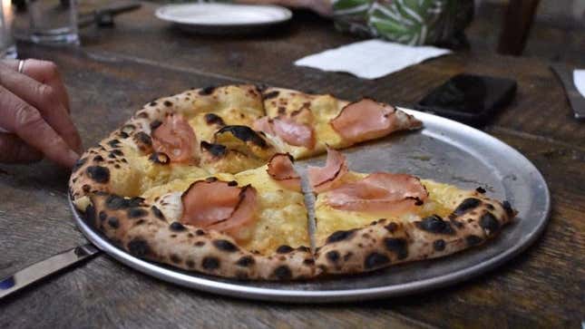 A Monte Cristo pizza with gouda, Canadian bacon, maple syrup