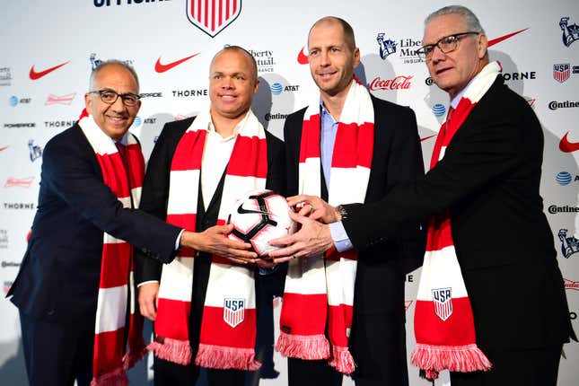 (From l. to r.) Outgoing U..S. Soccer Federation President Carlos Cordeiro, National Team General Manager Earnie Stewart, Men’s Head Coach Gregg Berhalter, and CEO Dan Flynn fondle a ball during happier times in December.