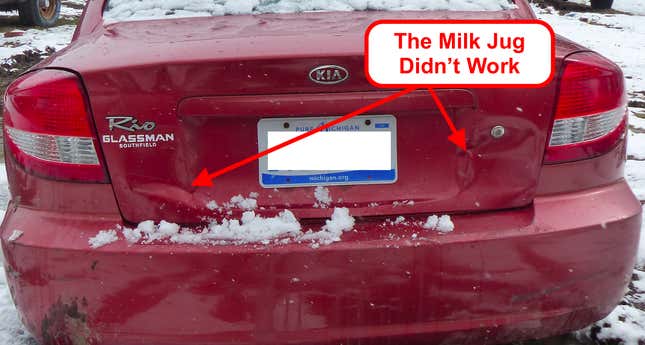 Image for article titled You Haven't Reached Rock Bottom Until You've Got A Totaled Kia Rio Stuck In Your Backyard