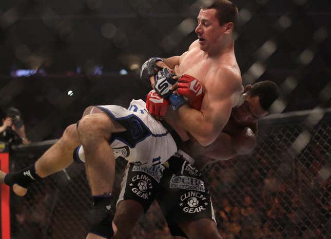 Walker takes down Scott Carson in his second MMA fight. Photo credit: AP/Jeff Chiu