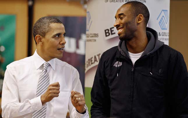 President Barack Obama (L) talks with Kobe Bryant of the Los Angeles Lakers while filling care packages during a NBA Cares service event at the Boys and Girls Club December 2010 in Washington, DC. Bryant and all the members of the 2010 NBA Championship Lakers team volunteered on projects at the club before being honored by the president for their victory.