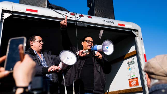 Bob Chamberlin, vice president of the Union of British Columbia Indian Chiefs, holds a bullhorn for Reuben George speaking to the crowd ahead of the protest.