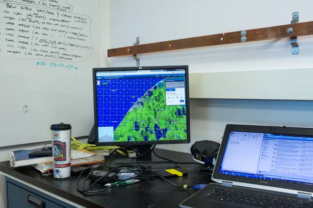 The desk in the lab where Ryan Cody, a GIS Analyst in Dr. Tweedie’s laboratory at the University of Texas at El Paso (UTEP), works while in Utqiaġvik. In addition to studying climate change effects in the area, Cody and his team create mapping tools that the community can access and use. Photo: Ash Adams/Gizmodo