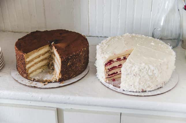 Two homemade layer cakes on a kitchen counter