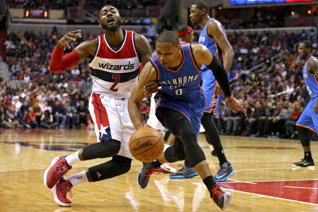 Russell Westbrook #0 of the Oklahoma City Thunder steals the ball from John Wall #2 of the Washington Wizards in the second half at Verizon Center on January 21, 2015 in Washington, DC. The Oklahoma City Thunder won, 105-103, in overtime. 
