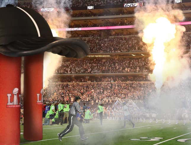 Image for article titled Official Sprints Through Giant Inflatable Referee Hat To Take Field For Super Bowl