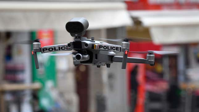 A police drone flies over a French marketplace on March 24, 2020 as local authorities enforce a nationwide lockdown to curb the spread of covid-19.