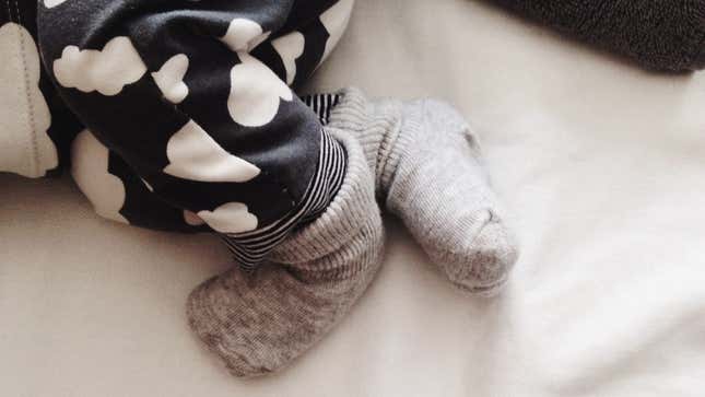Image for article titled Cover Your Breast Pump Bottle With a Baby Sock