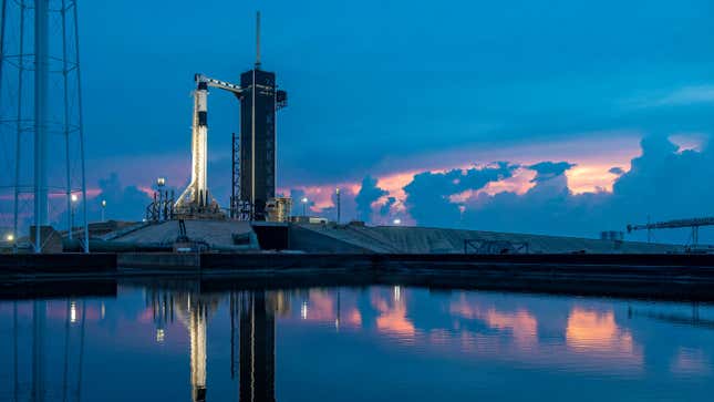 In this handout photo provided by SpaceX, the SpaceX Falcon 9 rocket with the manned Crew Dragon spacecraft sits on launch pad 39A at the Kennedy Space Center on May 26, 2020 in Cape Canaveral, Florida.