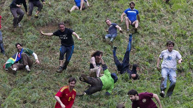 Cheese Roll competitors running and falling down large hill