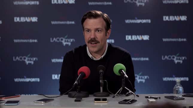 Screenshot from Ted Lasso: Ted speaking at a press conference