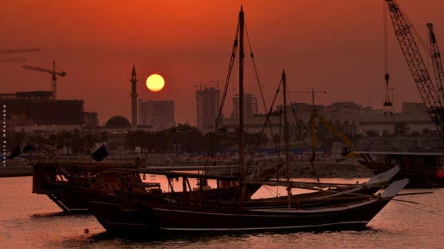 The sun sets on Doha.