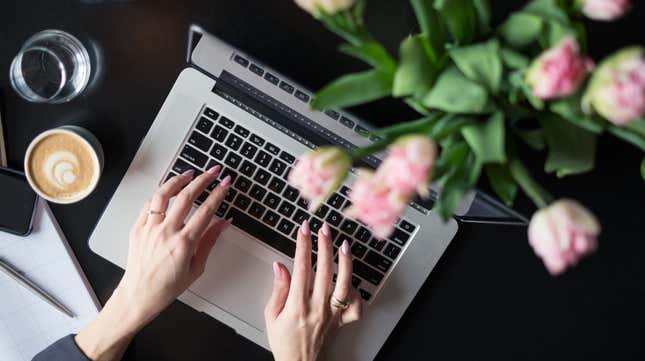 This stock-photo “blogger” can afford both fresh-cut flowers and a latte. 