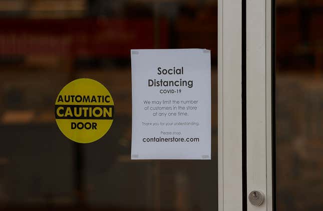  A sign about social distancing is seen at the entrance of The Container Store near Perimeter Mall on March 20, 2020 in Atlanta, Georgia. The stores are limiting the number of people allowed inside to help prevent the spread of coronavirus. 