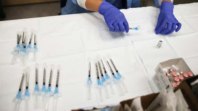 Vaccine doses in syringes on a table