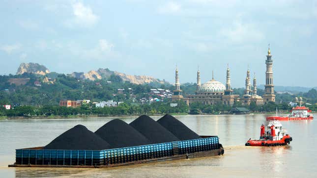 A barge on the Mahakam River with coal from the mining area in Samarinda, East Kalimantan, Indonesia.
