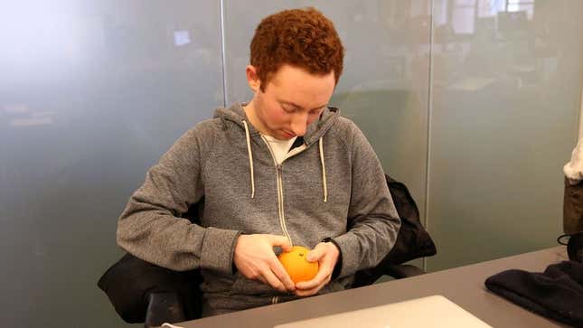 Image for article titled Man Struggling To Pierce Orange Peel With Fingernail Under Impression He Could Kill If He Had To
