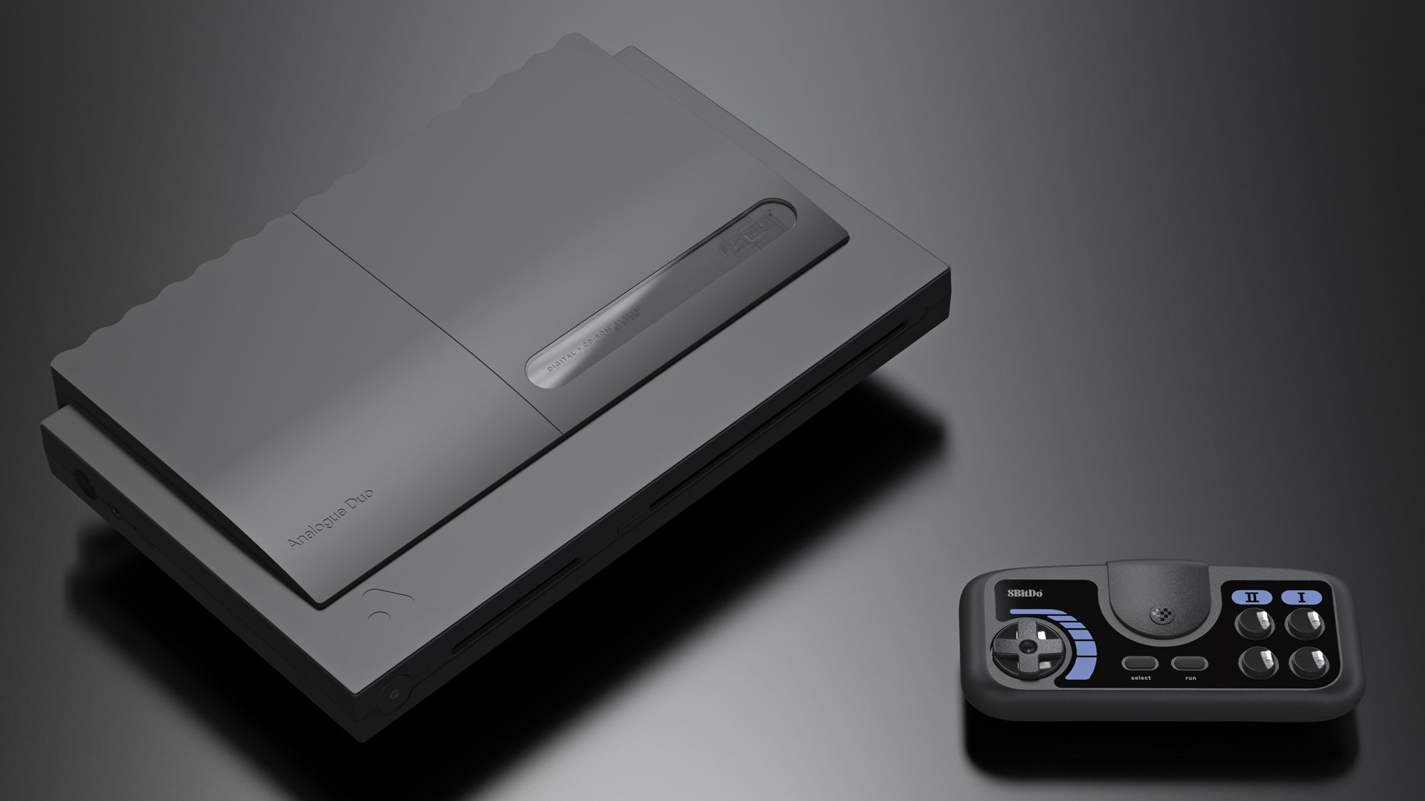 وحدة التحكم التناظرية الثنائية ذات اللون الأسود بجانب لوحة الألعاب اللاسلكية 8BitDo.
